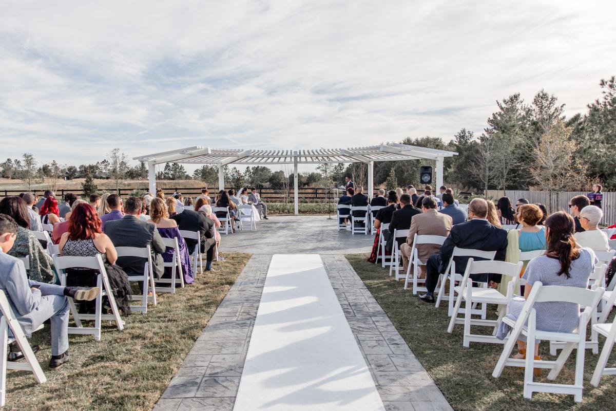 Space in Front of Pergola Full with Wedding Attendees