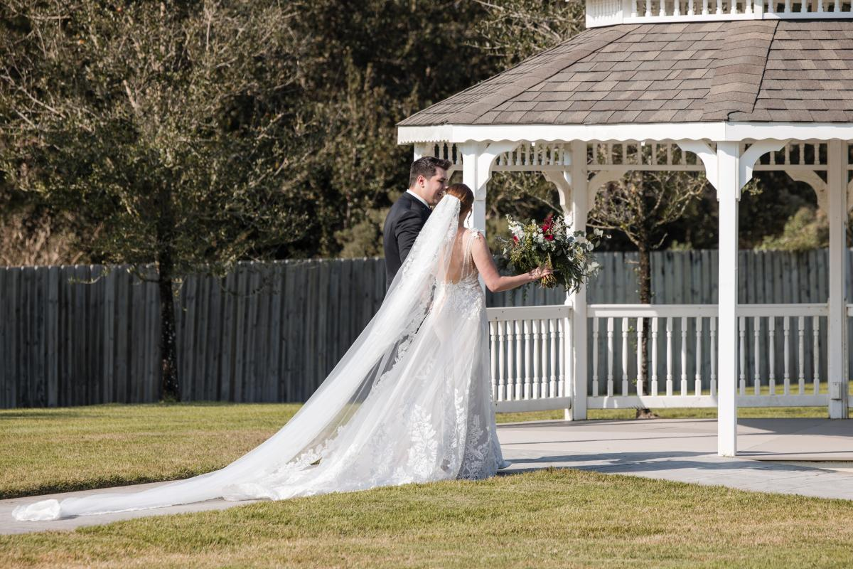 Wedding Couple Entering Under Gazebo