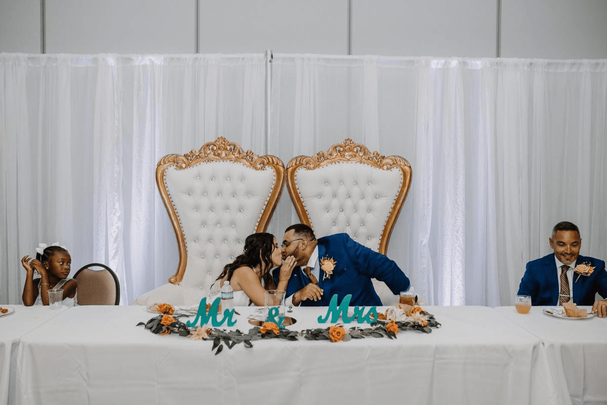 Couple Kissing at Their Table